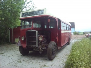 In front of the bus shed, awaiting its turn for restoration 