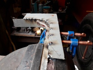 Tack welding front face to  sill of window frame corner section