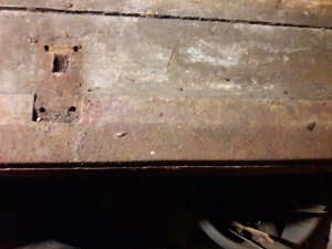 Location of striker plate in boot floor
