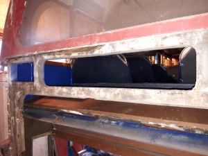 Timbers forming the top of the boot opening and base of the rear window